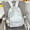 Mochila estilo retrô americano com estampa de estrelas, estilo coreano, para estudantes do ensino fundamental II e médio, grande capacidade, versátil, leve e casual