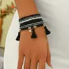 Pulsera apilada de cuentas de semillas con colgante de borla de cuentas bohemia más vendida transfronteriza con un diseño geométrico de alta gama