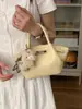 Bolsa Única com Textura Pequena Tote Bag para Mulheres 2026 Estilo Novo da Primavera Bolsa de Cesta Simples Ombro Transversal Bolsa Asa
