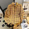 Camisa xadrez amarela de manga comprida para homens, pura estação 2026 novo design, jaqueta camisa estilo Hong Kong retrô solta de nicho