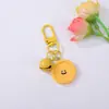 Llavero Colgante de Flor Geométrica de Resina con Cara Sonriente de Color Caramelo Forma de Corazón DIY Accesorio Creativo para Mochila Decoración
