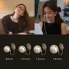 Elegantes Pendientes de Clip Estilo Francés con Perlas Artificiales para Mujeres Sin Perforaciones, Diseño de Espiral para Mosquitos, Nicho de Alta Gama Nuevos Pendientes Otoño e Invierno 2026