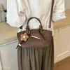 Bolso Mujer 2026 Moda Versátil Bolso de Mano Bolso al Hombro Sentido Versátil Temperamento Nuevo Viaje Diario Casual Otoño Cuadrado Pequeño
