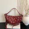 Bolsa feminina de grande capacidade, nova bolsa sela vintage com tachas primavera-verão 2026, bolsa de ombro e transversal de alta qualidade para o dia a dia