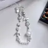 Cadena Minimalista para Teléfono con Perlas y Lazo, Correa de Muñeca, Cadena de Mano, Portacámaras y Llavero para Mujer
