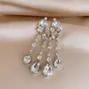 Banquete Nocturno del Palacio~Pendientes Largos con Borla de Gota de Agua Redonda Tachonados con Diamantes de Aguja Plateada, Pendientes Exquisitos y Exagerados con un Toque de Lujo Ligero y de Alta Gama