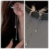Pendientes Genie con clip para la oreja, estilo dulce y moderno, con borlas de metal para mujer, estilo elegante de celebridades de Internet 2023.