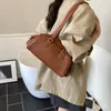 Bolsa de Axila Moda Coreana para Mulheres 2025 Nova Bolsa Tote Bowling Retrô Nicho Versátil Bolsa de Ombro de Mão