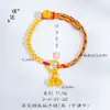 Puzuo Arena Antigua Loto Dorado Año Nuevo Zodiaco Dorado Perla Dorada Trenzado Cuerda de Mano Pulsera Lujo Accesible Nicho Exquisita Joyería de Mano