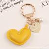Nuevo Colgante Llavero Corazón de Cuero Aleación Creativo Colorido Corazón de Durazno Perla Accesorios Pequeña Decoración de Bolso Fresca