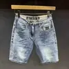 Shorts de Mezclilla Azules Lavados Bigotes de Gato Marca de Moda para Hombre Combinan con Todo Corte Delgado Combinan con Todo Estilo Coreano Popular Pantalones Casuales Microelásticos