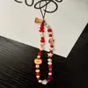 Cadena de teléfono móvil de cuentas frescas de verano llavero hecho a mano con cuentas expresión linda bolsa colgante ccd decoración