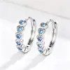 Pendientes de circonitas coloridas de moda de estilo coreano Cao Shi, pendientes de anillo de amor con corazón de arcoíris, pendientes de corazón de moda europeos y americanos.