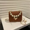 Bolsas Elegantes de Personalidade Tecidas para Comércio Exterior 2026 Moda Casual Bolsa de Ombro Transversal Tendência Feminina Pequena Quadrada Texturizada