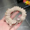 Diadema plisada con volantes de alta apariencia, estilo femenino y suave, alta elasticidad, versátil, accesorio para el cabello simple y moderno