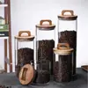 Venta al por mayor de fábrica tapa de madera con asa frasco sellado de vidrio almacenamiento de snacks caja de almacenamiento de granos de café frasco sellado para exhibición de té