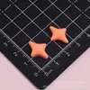 Accesorios de resina de color sólido brillante con forma de estrella de cuatro puntas, materiales DIY de pegamento cremoso para fundas de teléfono, imanes de nevera y accesorios para el cabello