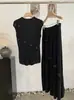Conjunto de Dos Piezas Omalai: Chaleco de Punto sin Mangas con Flores Tridimensionales y Falda Larga Nueva Colección Primavera/Verano 7007