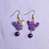 Pendientes de mariposa con cuentas de colores para niñas, color morado y rosa, bonitos y distintivos, con gancho para la oreja, regalo festivo, joyería transfronteriza.