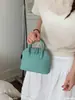 Bolso de Mano con Forma de Concha Yueziz Design para Mujer Otoño/Invierno 2026 Nueva Versión Coreana Bolso Chic Vintage para el Trabajo Bolso de Hombro Cruzado