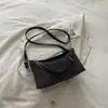 Elegante bolso de mujer 2026 otoño nuevo bolso de axila para el trabajo, bolso de hombro cruzado de diseño de nicho moderno y simple