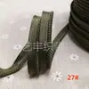 En stock 48 colores poliéster velcro con borde de cordón ribeteado tira de inserción de cuerda para ropa colchas sofás cojines tira de ribete