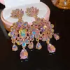 Pendientes colgantes ovalados con forma de gota de agua incrustados con diamantes rosas transfronterizos europeos y americanos, estilo de moda y exagerado, pendientes de lujo ligero y de alta gama para mujer