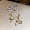 Pendientes de Clip~Oro Real de 14K Electrochapado Diseño de Estrella con Circonita, Simples y de Moda, Estilo de Lujo Ligero, Diseño Único, Pendientes sin Perforación