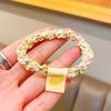 Dulce color caramelo cuerda para el cabello tejida tienda de 2 yuanes accesorios para el cabello estilo coreano adorno para la cabeza nuevo niña fruta etiqueta de tela lazo cabeza goma para el pelo
