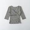 Ropa de Mujer al por Mayor Transfronteriza Estilo Europeo y Americano 2026 Verano Nuevo Camiseta de Manga Tres Cuartos con Cuello en V Cruzado Top Simple Versátil