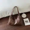 Bolsa Retrô Vazada para Mulheres 2026 Novo Estilo Bolsa de Ombro Única para o Dia a Dia Bolsa de Mão Versátil e Fashion Bolsa Tote Tendência de Grande Capacidade