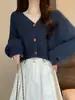 Chaqueta de punto retorcido con cuello en V retro para mujer Otoño e Invierno 2025 Nuevo Top de punto holgado estilo perezoso de manga larga