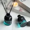 Frasco de aromaterapia personalizado para pendurar, em formato de sino, fabricado internacionalmente. Frasco vazio com vareta difusora. Frasco difusor com cores em degradê. Ideal para decoração de hotéis e restaurantes.