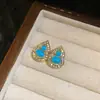 Nuevos pendientes de botón con colgante de calabaza ovalada de resina con incrustaciones de diamantes chinos, pendientes de lujo ligero de alta gama, pendientes hechos a mano de nicho para mujer