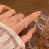 Cuerda Elástica Anillo Ajustable con Perlas y Cuentas para Mujer Retro Nicho Simple Anillo de Bola Dorada Nueva Joyería de Mano Personalizada