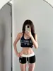 Shorts deportivos sexys de cintura baja estilo americano para mujer, pantalones capri de bloques de color, adecuados para usar en casa y al aire libre, ajustados, hot pants que realzan las caderas para el verano