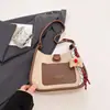 Bolsa Feminina 2026 Primavera Nova Bolsa Transversal Textura Retrô Bolsa de Ombro Estilo Balde Cor Tendência Color-Blocking Bolsa Pequena para o Dia a Dia