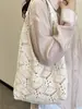 Bolsa de Mujer Shuai Mijia 2026 Verano Nueva, Bolso Tejido de Paja con Flores Caladas, Bolso de Hombro para Vacaciones, Bolso Cruzado de Playa