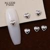 Nuevos accesorios de aleación para decoración de uñas con forma de corazón torcido tridimensional liso con diseño de amor hueco retro japonés