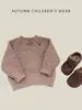 Suéter tejido de otoño/invierno para bebé y niño pequeño con botones en el hombro, suéter de cuello redondo color avena para niños, top moderno para bebés niños y niñas