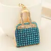 Estilo de Moda de Lujo Ligero Europeo y Americano Mini Bolso de Mano Completamente Cubierto de Diamantes Colgante para Llavero Diseño de Nicho Accesorio para Bolso de Mujer