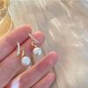 Nuevos pendientes de perla de agua dulce natural con nota musical, pasador de plata s925, moda francesa de lujo ligero, pendientes simples, para mujer de alta gama
