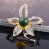 Broche de perla de flor pequeña mate Youzun Pin de platino azul de alta gama coreano Ramillete de flor joyería para ropa al por mayor