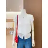 Blusa de encaje texturizado con cuello redondo y mangas abullonadas en blanco, hombros descubiertos, de la fábrica original, hecha de tejido de punto Tencel de alta elasticidad