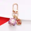 Estilo Chino Atrae Fortuna Cerámica Gato de la Suerte Llavero Colgante Estuche para Auriculares Bolso Encanto Accesorio Adornos Pequeños Venta al por Mayor
