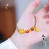Pulsera de la Suerte Bolsa de Arena Dorada Estilo Mismo de la Joyería Puzuo Nuevo Chinoiserie Pulsera de Cristal de Gama Alta Tejida a Mano