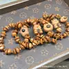 Estilo Casual de Cocinero con Madera de Durazno Grano de Café Lavado Oso Pulsera Círculo Único Plato de Mano con Cuentas Budistas Pulsera de Rosario