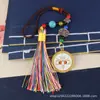 Bolsa con borla Ojo del Dios de la Riqueza de Cinco Vías del Tíbet Cordón Colgante Unisex Material Metálico Colgante para Interior de Coche