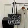 Nova Bolsa Tote de Outono Feminina Estampada para o Trabalho 2025 Estilo Estrangeiro Moda Simples Bolsa de Ombro de Mão