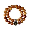 Agita las explosiones de sonido corazón material viejo pulsera de bodhi nube de fuego cuentas redondas doble círculo texto jugar cuentas de mano venta directa de fábrica
